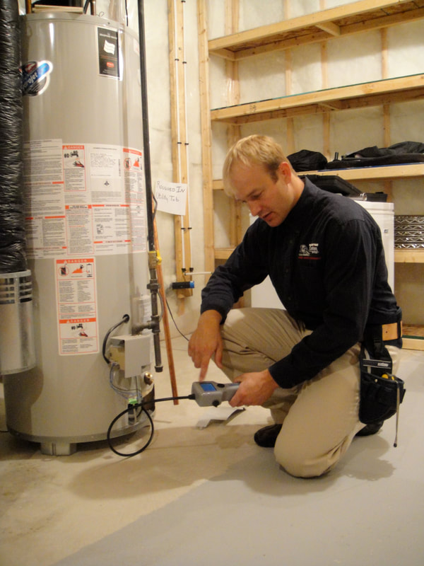 home inspector checks water heater